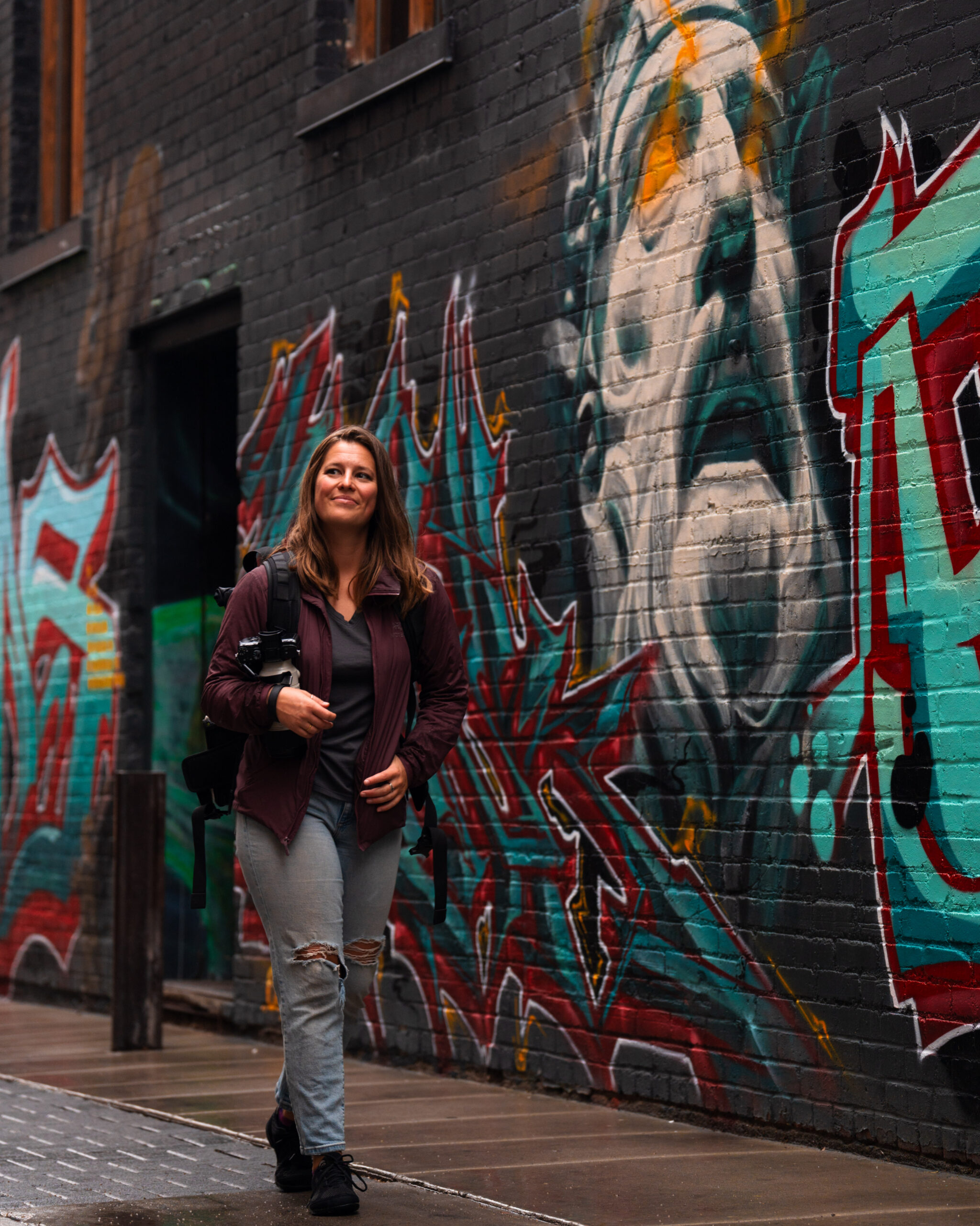 Photo of Candice Kalb by Logan Foll of Foll Exposures walking through Freak Alley Gallery in Boise Idaho